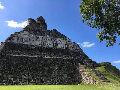 side angle of mayan ruin with carving