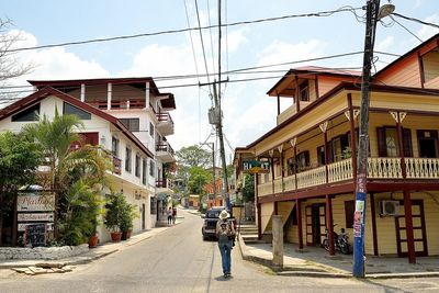 Street where shared taxi stops tourist in front of guest house