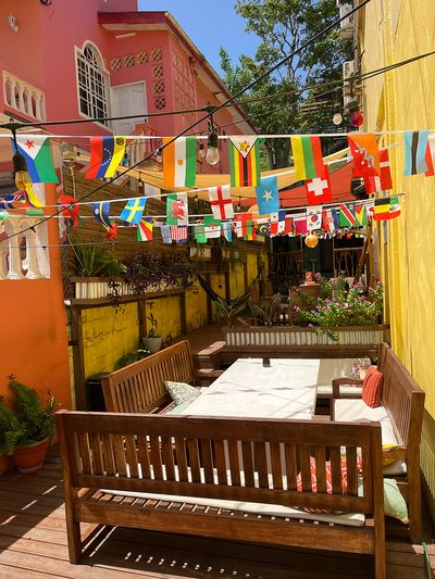 Yellow Belly Backpackers patio outside patio with tiny flags hung on top